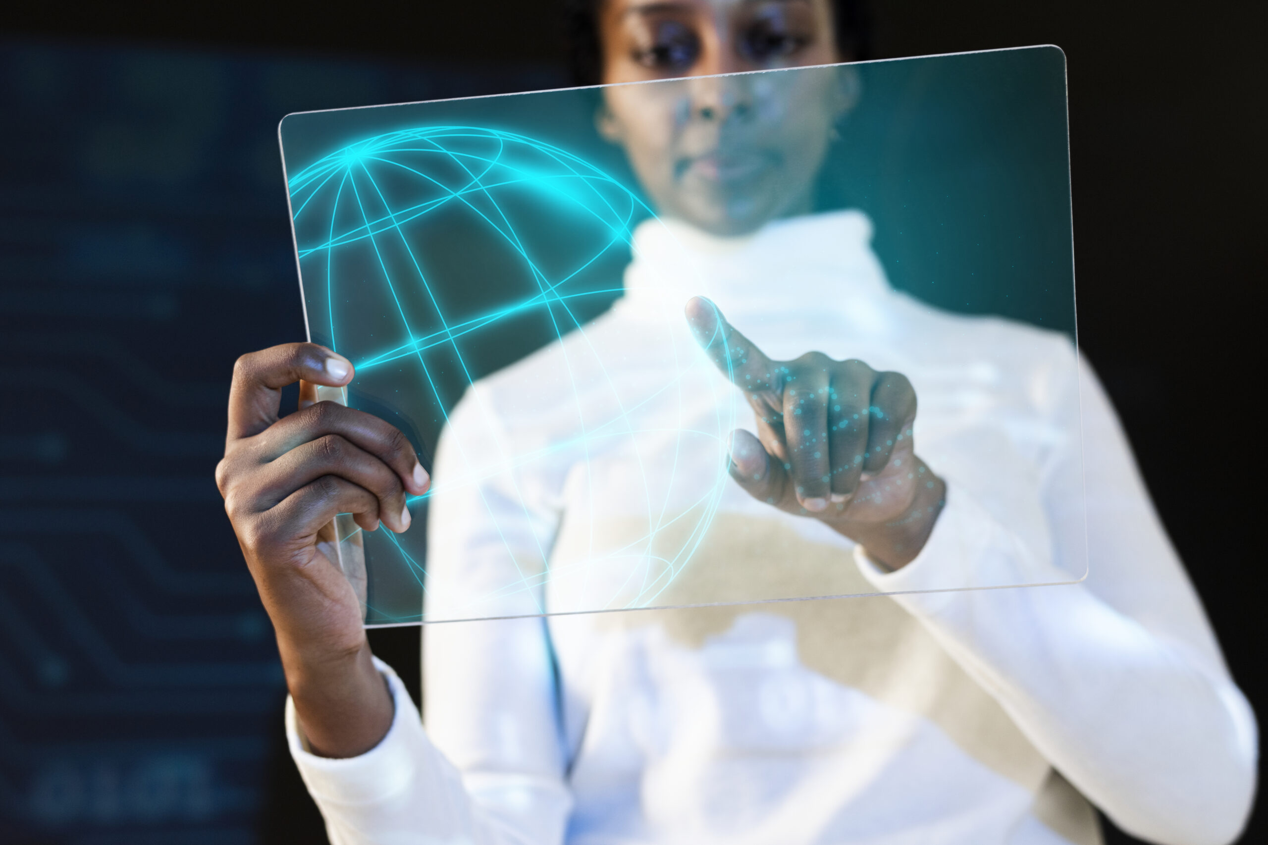 African American woman using transparent tablet futuristic technology